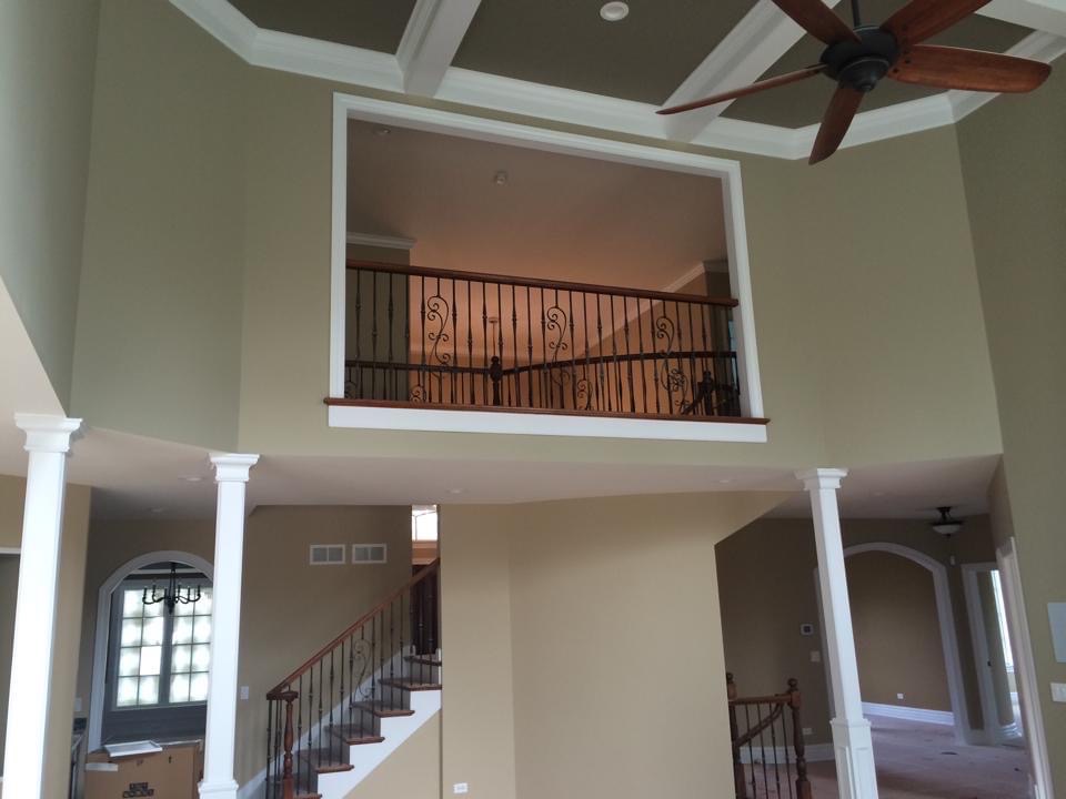 Vaulted ceiling entryway with upstairs overlook